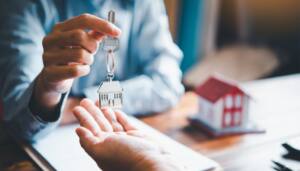 elling Your Home in Lucan, Ireland — model house, checklist, and keys on a desk